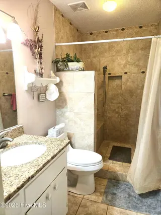 1014a Kings Way, New Bern, NC 28562 – photo 14: Bathroom with seated tile shower