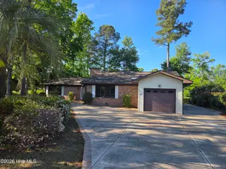 63 Carolina Shores Drive, Carolina Shores, NC 28467 – photo 1: Front of Home