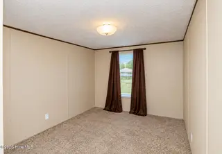 102 Bonnie Farms Road, Dudley, NC 28333 — 3-bedroom manufactured home in Bonnie Farms, Dudley, NC, photo 18 of 20: bed