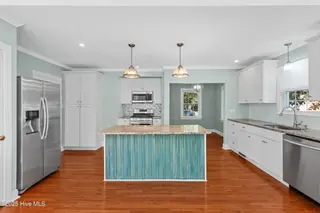 102 N 25th Street, Wilmington, NC 28405 — 2-bedroom home, Wilmington, NC, photo 7 of 35: Open Kitchen - Sunroom