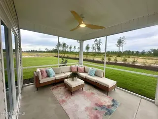 7445 Linda Vista Lane, Leland, NC 28451 – photo 14: Screened in patio