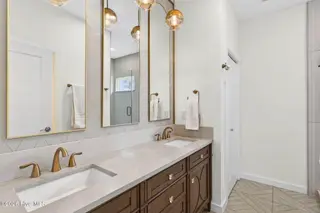 1708 Oakbrook Drive SW, Ocean Isle Beach, NC 28469 – photo 23: Master Bath with Brushed Brass Accents