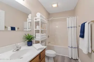 219 N Lake Keziah Drive, Southport, NC 28461 — 3-bedroom home in Boiling Spring Lakes, Southport, NC, photo 21 of 30: Photo 11 Guest bath AI