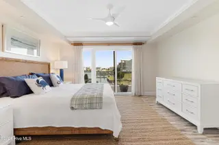 212 Old Causeway Road 107 & B13 Slip, Beaufort, NC 28516 — 3-bedroom condo in Morgan Creek Landing, Beaufort, NC, photo 6 of 49: Primary suite with water views
