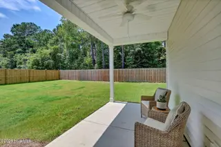1149 Tennessee Walker Way, Bolivia, NC 28422 — 3-bedroom home in River Tide Farms, Bolivia, NC, photo 19 of 19: Covered Back Patio
