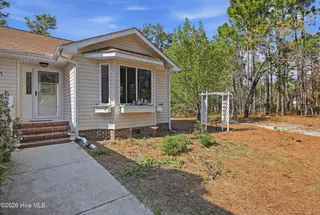 1281 Spring Lake Drive, Southport, NC 28461 — 3-bedroom home, Southport, NC, photo 3 of 46: Inviting Walkway & Bay Window Feature