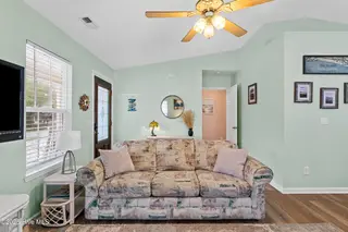 316 NE 52nd Street, Oak Island, NC 28465 – photo 17: 13_living room