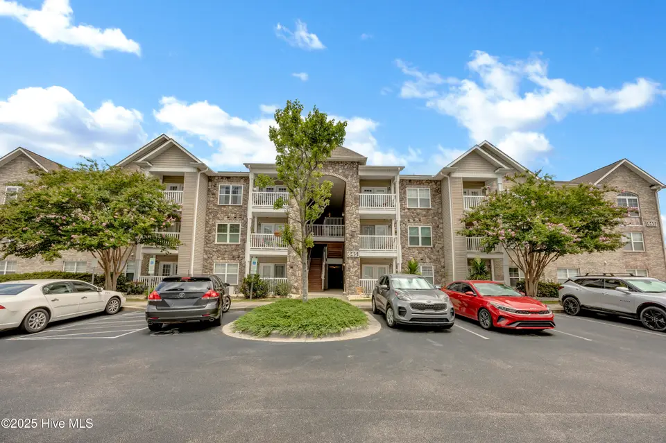 645 Condo Club Drive Unit 302, Wilmington, NC 28412 – photo 1 of 25: Front of Building