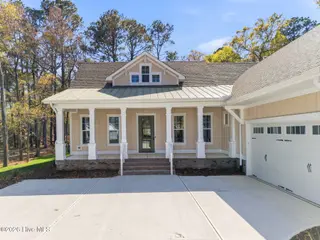 1943 Redfish SW, Supply, NC 28462 — 4-bedroom home in Oyster Harbour, Supply, NC, photo 3 of 42: Front Exterior
