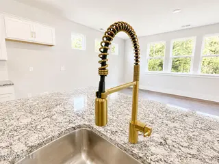 8635 Blue Haw Way Lot 130, Leland, NC 28451 — 5-bedroom home in Indigo Preserve, Leland, NC, photo 12 of 33: Kitchen Island