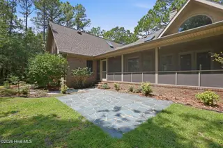 110 Sutton Drive, Cape Carteret, NC 28584 – photo 11: Back-screened porch and patio