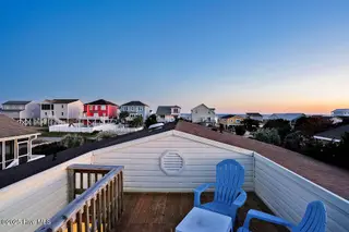 2021 W Dolphin Drive, Oak Island, NC 28465 – photo 6: 2021WestBeachDrivetwilight-2