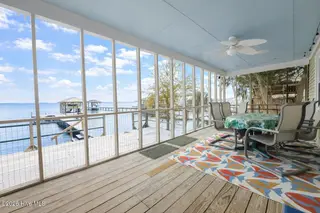 2908 Canal Cove Road, Lake Waccamaw, NC 28450 – photo 6: 2908 Canal Cove - Back Porch Interior