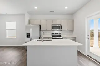 1078 Hanson Drive, Leland, NC 28451 – photo 7: 7-Kitchen and Otdoor Access to Back Cove