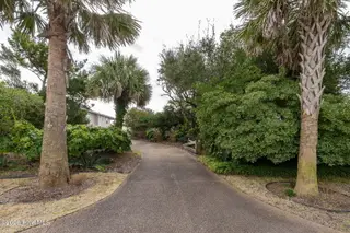 111 Dogwood Circle, Pine Knoll Shores, NC 28512 – photo 11: Beautifully landscaped driveway