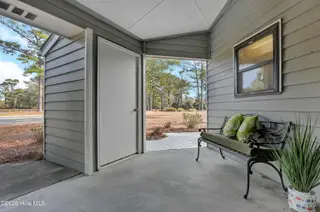 724 Azalea Drive 433, Hampstead, NC 28443 – photo 7: Covered Porch & Storage