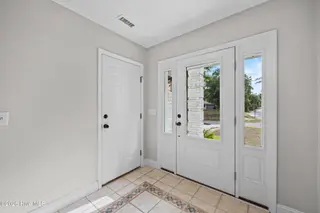104 SW Yacht Drive, Oak Island, NC 28465 — 5-bedroom waterfront home, Oak Island, NC, photo 11 of 77: 7_foyer