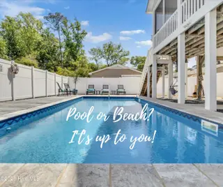 804 E Oak Island Drive, Oak Island, NC 28465 – photo 3: 804 E OAK ISLAND DR - POOL VIEW WITH GRA