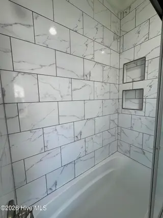 702 N Charlotte Street, Washington, NC 27889 – photo 19: tiled wall shower with nooks