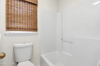 212 Kings Trail # A, Sunset Beach, NC 28468 – photo 23: Upstairs guest bathroom