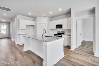 3200 Butterfly Ginger Street Lot 149, Leland, NC 28451 — 4-bedroom home in Indigo Preserve, Leland, NC, photo 15 of 39: Kitchen