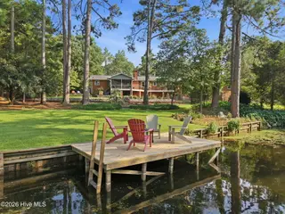 22 Pine Lake Drive, Whispering Pines, NC 28327 – photo 6: Private Dock and Paddleboat