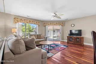 908 Resort Circle Unit 512, Sunset Beach, NC 28468 — 2-bedroom condo in Colony II, Sunset Beach, NC, photo 15 of 39: Living Room