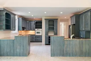 86 Plantation Passage Drive SE, Bolivia, NC 28422 — 4-bedroom home in Winding River Plantation, Bolivia, NC, photo 17 of 77: Kitchen