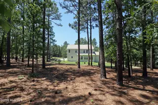 39 Forest Lake Drive, Jackson Springs, NC 27281 – photo 5: 5 Back of home from property line