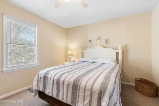 166 NW 7th Street, Oak Island, NC 28465 – photo 24: Upstairs 1st bedroom