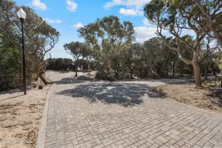 105 Lot 3 3 Roosevelt Reserve Park Place, Pine Knoll Shores, NC 28512 – photo 4: Charming Paver Roadway