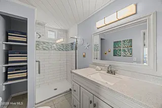 5127 W Beach Drive, Oak Island, NC 28465 – photo 15: 27_bathroom