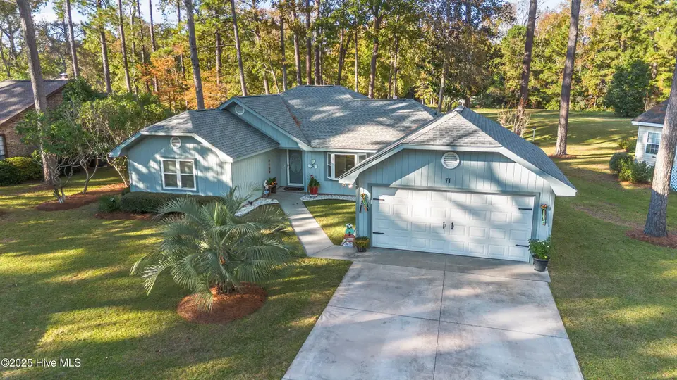 71 Carolina Shores Drive, Carolina Shores, NC 28467 – photo 1 of 50: Front of Home