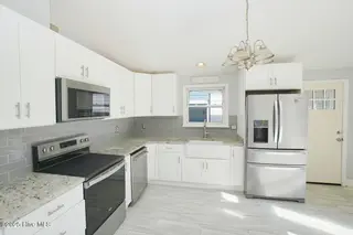 127 NW 10th Street, Oak Island, NC 28465 – photo 6: 127 NW 10th St Oak Island NC-large-009-0