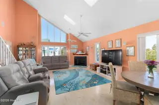 117 Island Quay Court, Atlantic Beach, NC 28512 – photo 11: Open concept Living room with fireplace