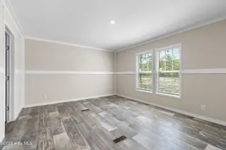 6830 Lewis Drive SE, Winnabow, NC 28479 – photo 20: Master bedroom