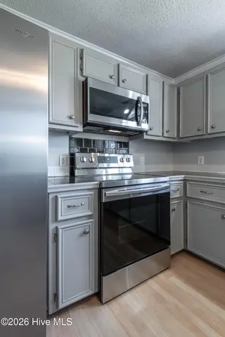 2403 Harness Court, Greenville, NC 27858 – photo 24: Range oven microwave
