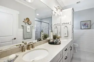 202 NE 64th Street, Oak Island, NC 28465 – photo 21: Ensuite full bathroom