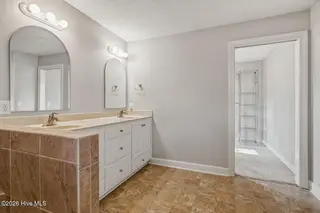 53 Country Club Drive, Shallotte, NC 28470 – photo 22: Bathroom leads to closet