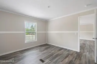 6777 Lewis Drive SE, Winnabow, NC 28479 – photo 14: Master bedroom
