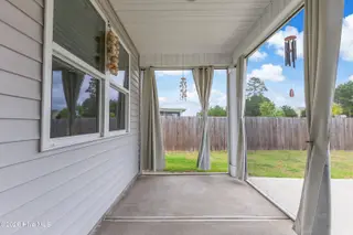 1038 Burled Oak Ridge Loop SE, Bolivia, NC 28422 — 3-bedroom home in Avalon, Bolivia, NC, photo 5 of 64: Screened porch