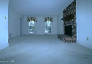 1313 Rondo Drive, Greenville, NC 27858 – photo 3: Expansive Living Area from Dining Area