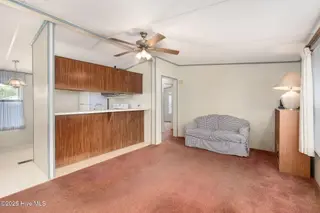 100 Lindsey Court, Beaufort, NC 28516 — 3-bedroom manufactured home in Green Meadows, Beaufort, NC, photo 9 of 38: Living, Kitchen Toward Bedrooms