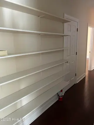 21 Village In The Woods Circle, Southern Pines, NC 28387 – photo 15: Back Hall with custom bookshelving