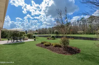 1092 Leesburg Drive, Leland, NC 28451 – photo 1: Looking at pond green grass
