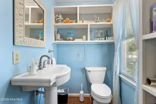166 NW 7th Street, Oak Island, NC 28465 – photo 21: Guest half bath