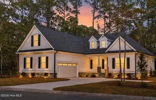 992 Ashburton Road SE, Bolivia, NC 28422 – photo 1: Front view at sunset