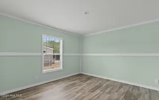 6823 Lewis Drive SE, Winnabow, NC 28479 – photo 16: Master bedroom