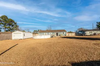 319 Riggs Road, Hubert, NC 28539 – photo 6: Back yard with 12x24 shed and pool