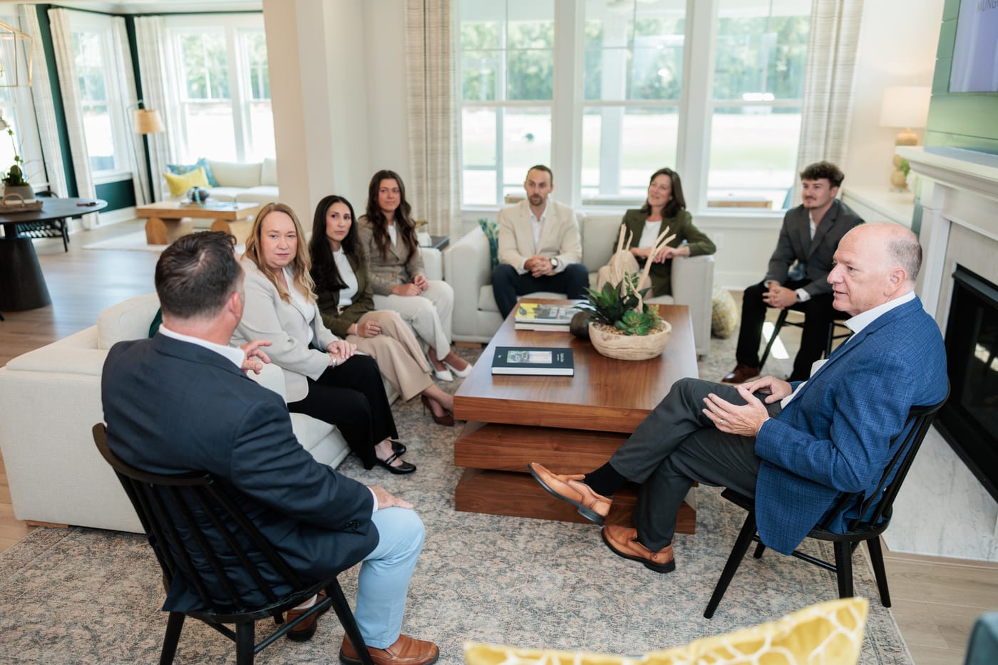 The team's morning huddle around the coffee table